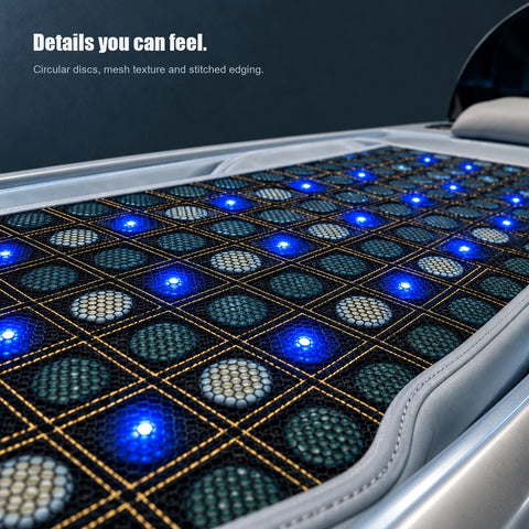 Close view of circular discs beneath black mesh, gold grid stitching, padded edging and blue light points